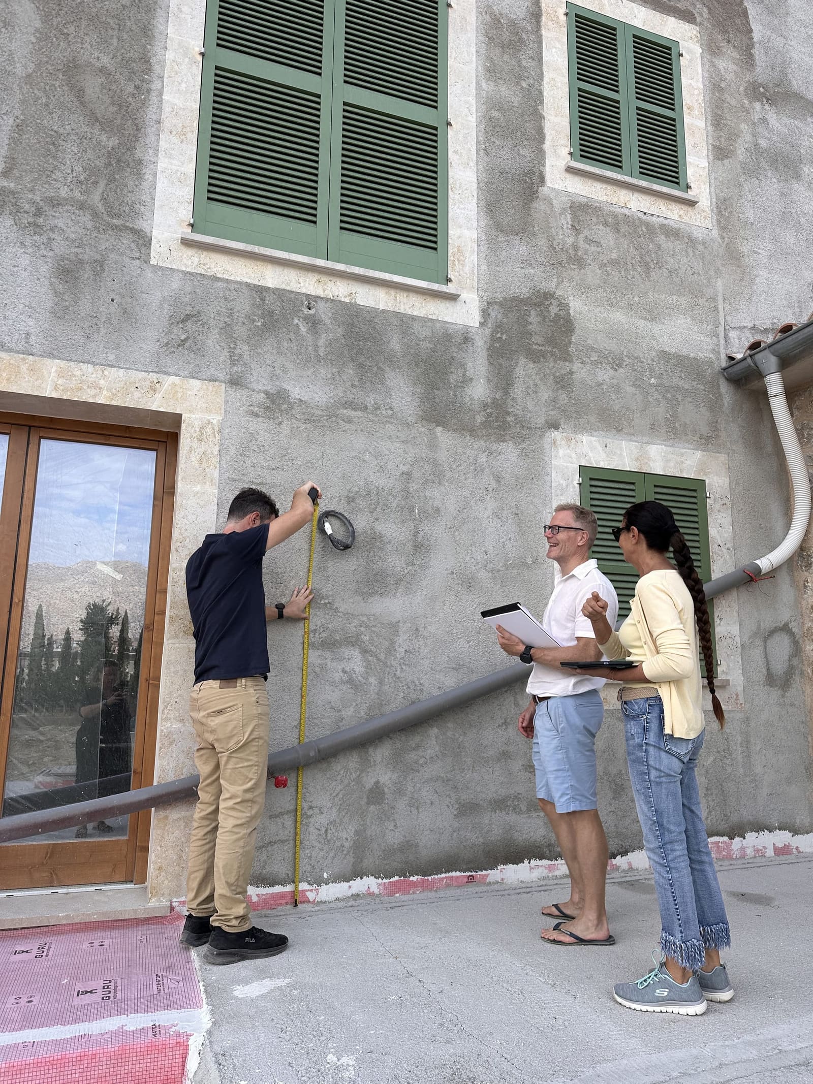 Measuring the mounting height of an outdoor wall light on a finca façade in Mallorca