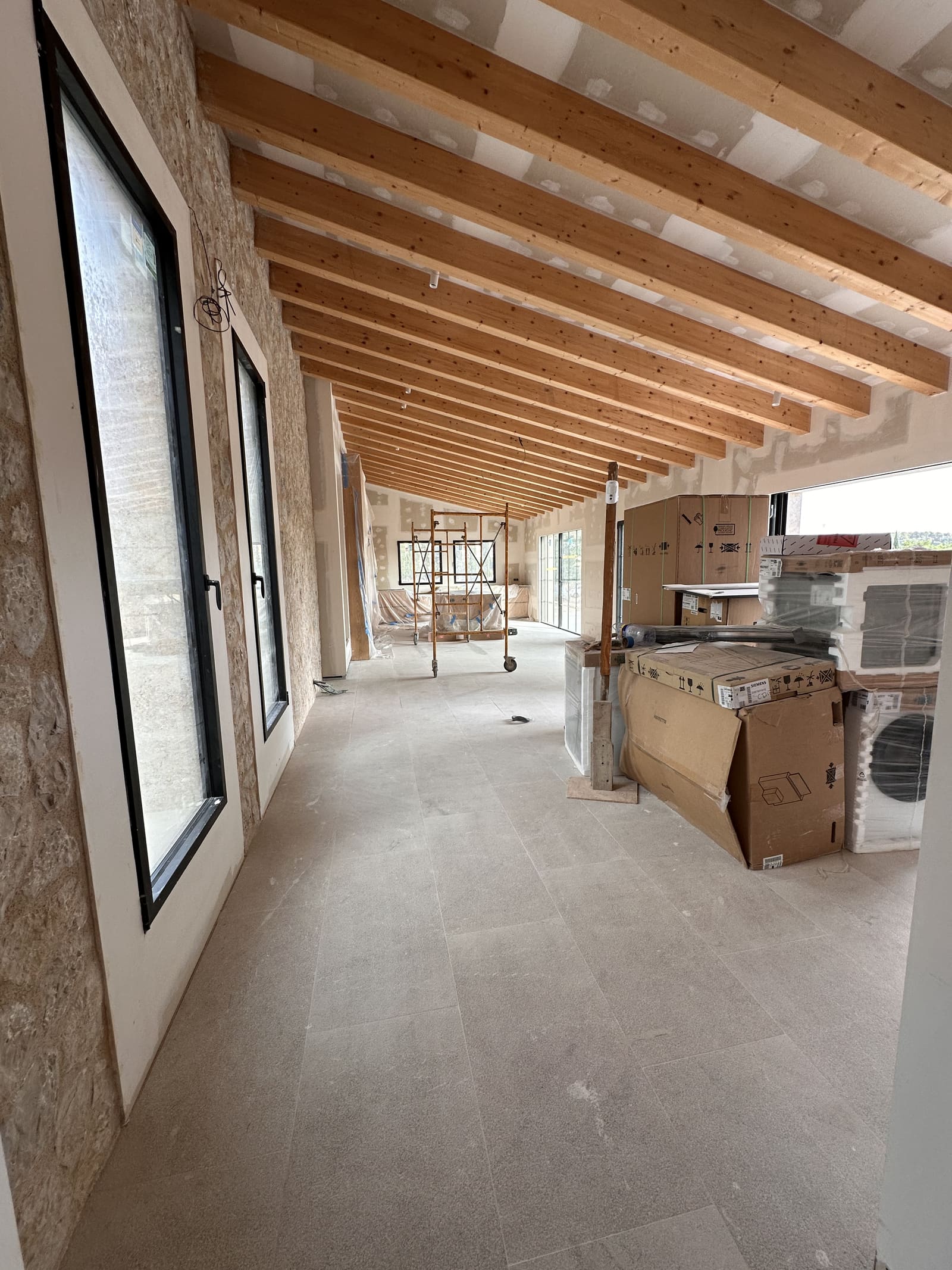 Boxed products inside a new-build finca during fit-out in Mallorca